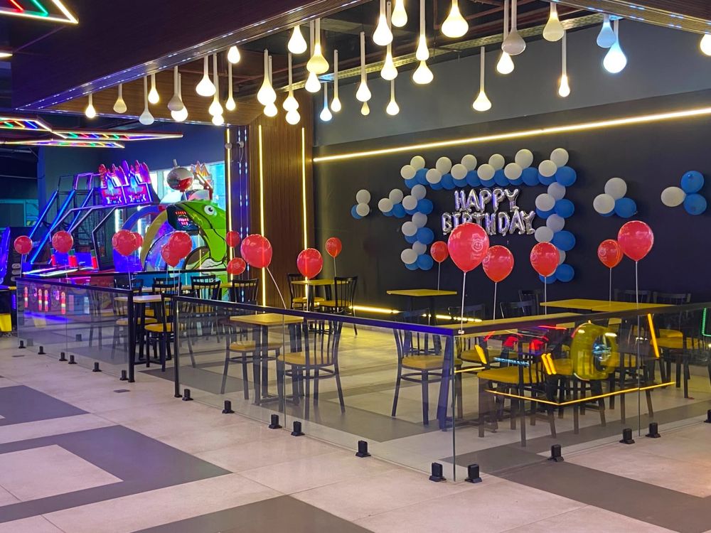 Birthday party set-up at Masti Zone with balloons and a Happy Birthday wall